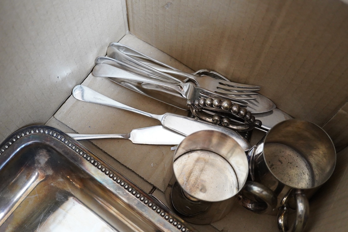 A quantity of assorted plated items including entrée dishes, flatware and mugs.